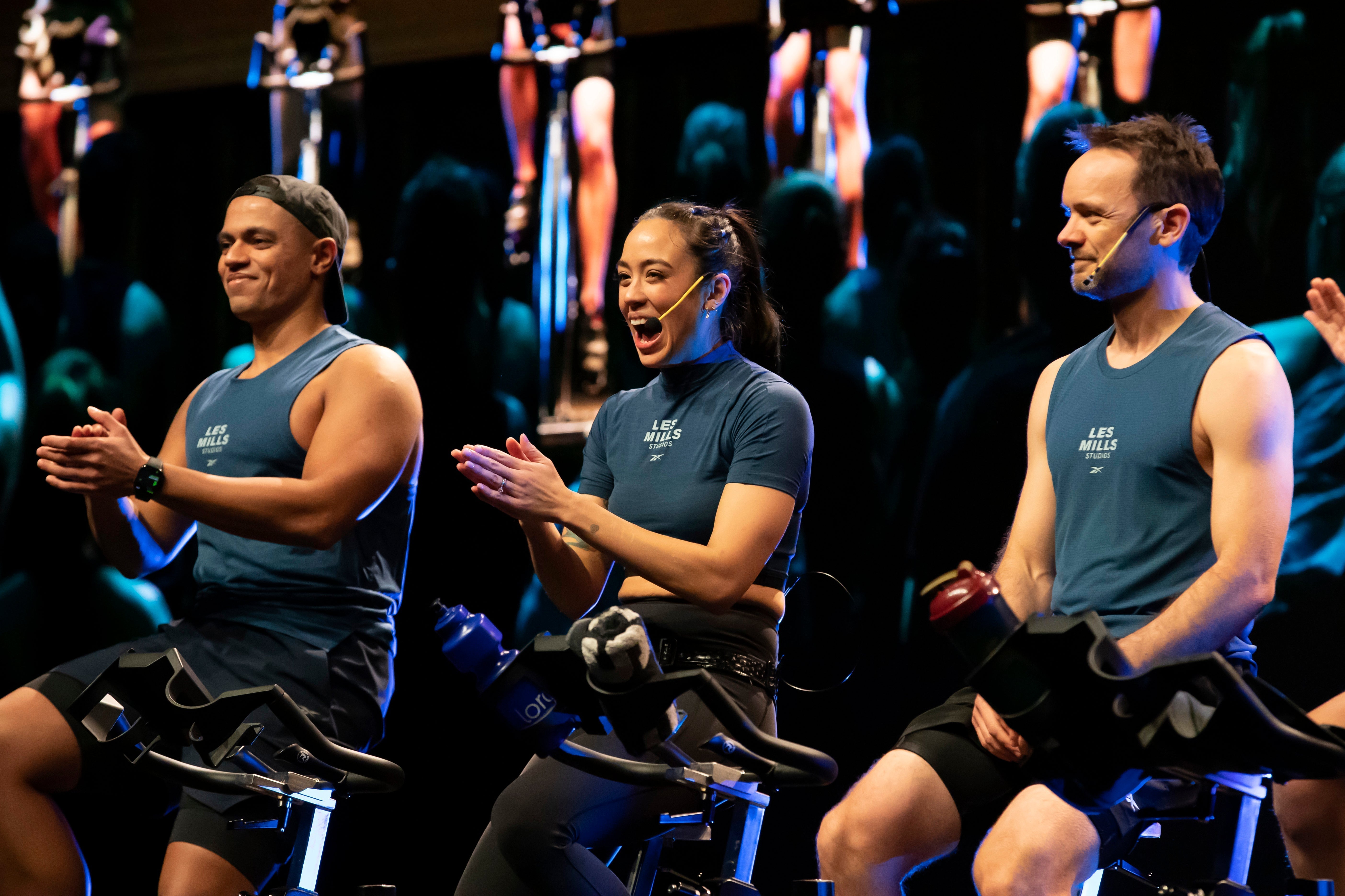 Fitness intructors using the Aeromic headset teaching their cycling class