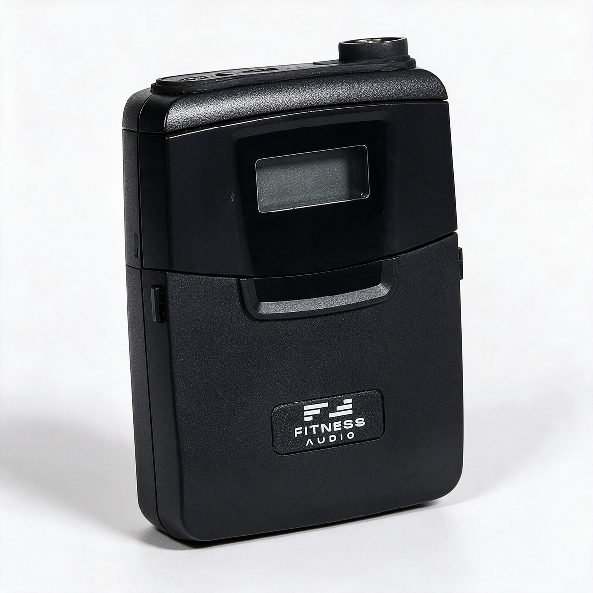 Close-up of the DX6-TF transmitter with its display, T4 headset socket and Fitness Audio logo