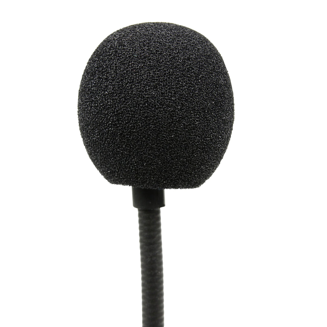A black round foam windscreen covering a microphone on the end of the boom arm of a headset.